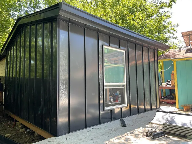 Black standing seam metal wall panels for Roof Inspection in Decatur